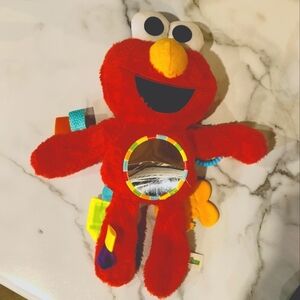 Elmo Baby Sensory Toy with Velcro and plastic loops to clip onto anything